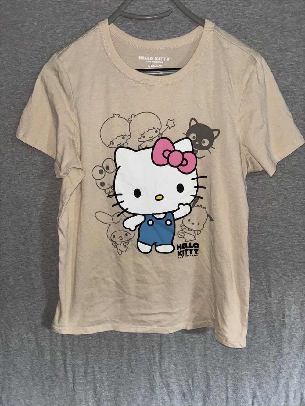Sanrio Hello Kitty Beige Tee with Pink Bow and Blue Overalls